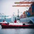 container-ship-and-tugboats-in-harbor-tacoma-was-2023-11-27-05-26-09-utc-min-2048x1363-1.webp